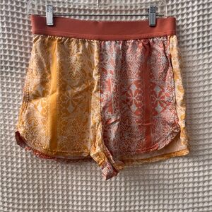 FP Movement by Free People Two-Tone Printed Athletic Shorts in Yellow & Coral